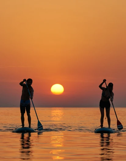 /assets/sunset-paddleboard.jpeg